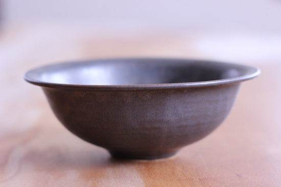 round earthenware pot (used as a decanter)