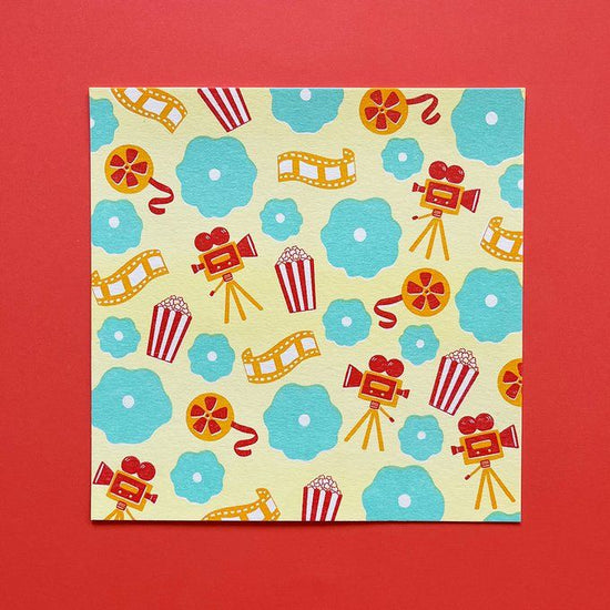 Film and mint-colored flowers postcard