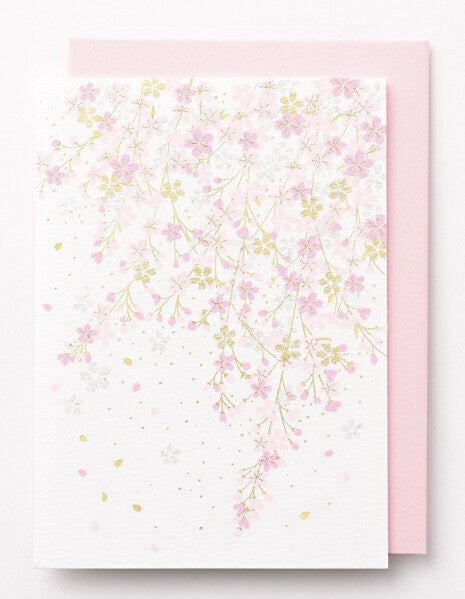 A greeting card featuring cherry blossoms.