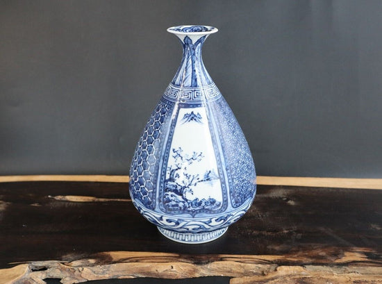 Vase for a single flower in a landscape underglaze blue