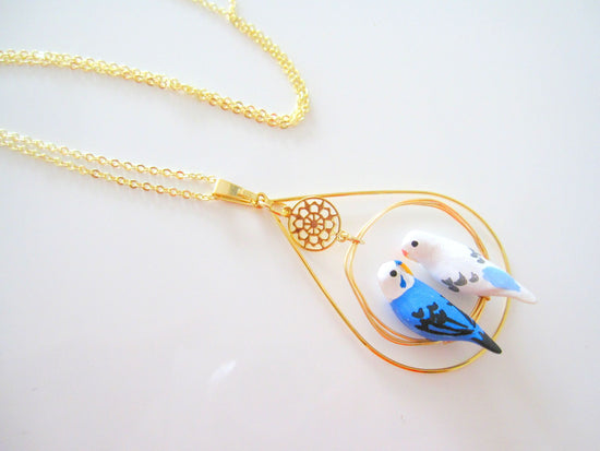 Pendant with Two Budgies (Blue and White) with Surrounding Accessoires