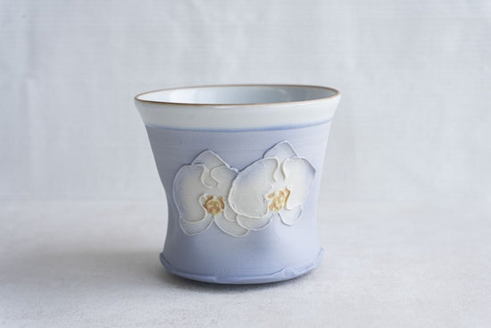 Blue cup with flower design