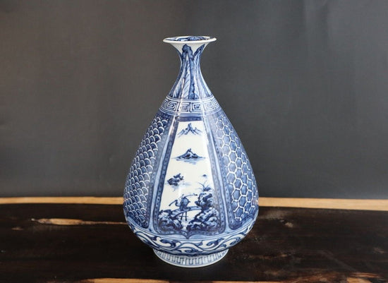 Vase for a single flower in a landscape underglaze blue