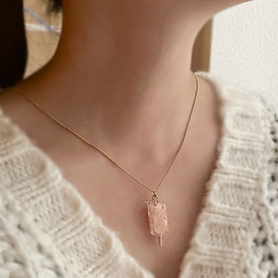 White strawberry popsicle necklace