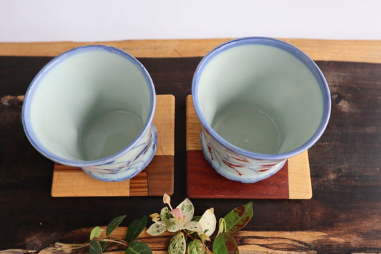 Ananote cup (underglaze blue, red glaze)