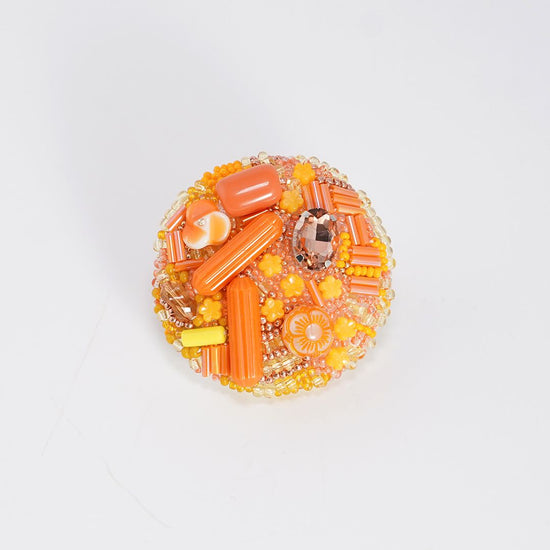 Monochrome brooch 2 bead embroidery orange collage