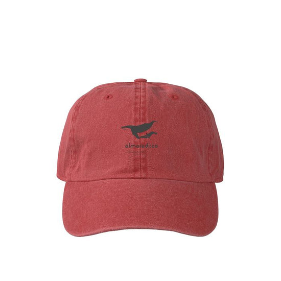 Pigmented cap red "Humpback whale parent-child bond" monochrome logo