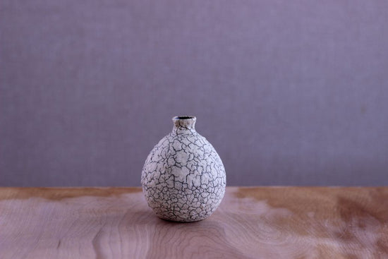 Vase in the shape of a sake cup
