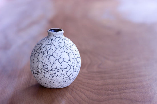 Vase in the shape of a sake cup