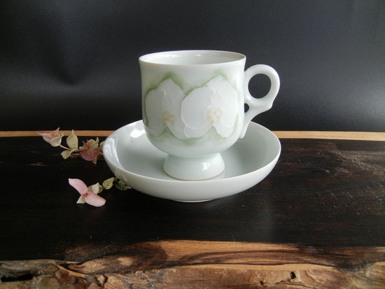 Coffee cup with flower design on high legs (Phalaenopsis orchid)
