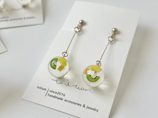 Clip-on earrings with vitamin-colored fruit kowloon balls