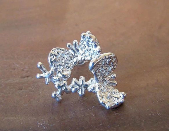 Pierced earrings of a frolicking butterfly, one of a kind 1.