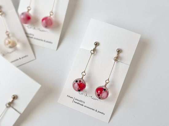 Clip-on earrings for triple-berry Kowloon ball