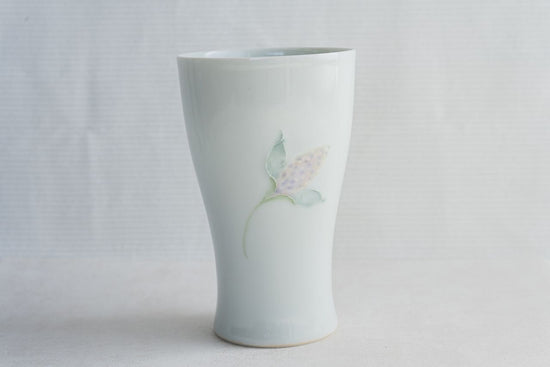 Pale celadon beer glass with floral design