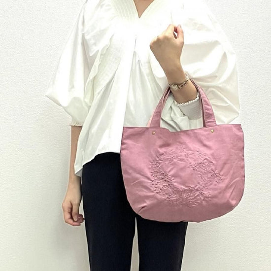 Peach skin style embroidered handbag