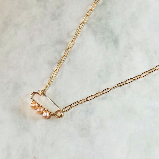 Safety pin design: pearl necklace