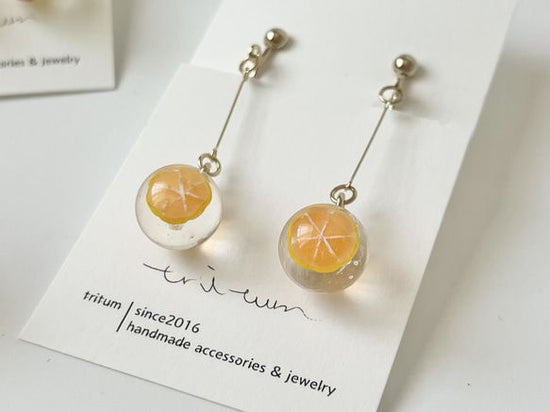 Pink grapefruit Clip-on earrings by Kowloon Ball