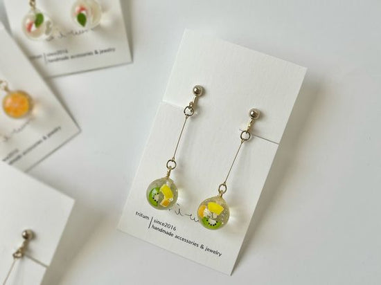 Clip-on earrings with vitamin-colored fruit kowloon balls