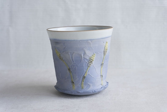 Blue cup with flower design