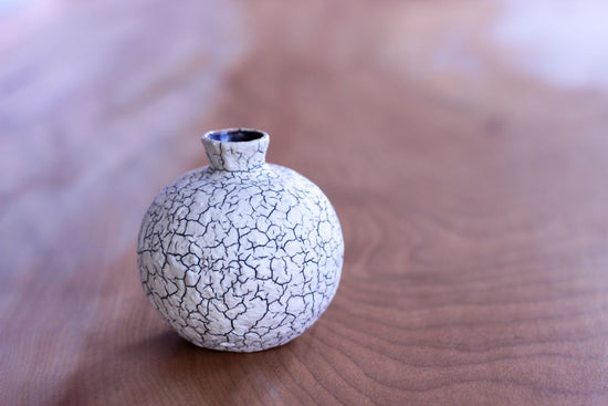 Vase in the shape of a sake cup