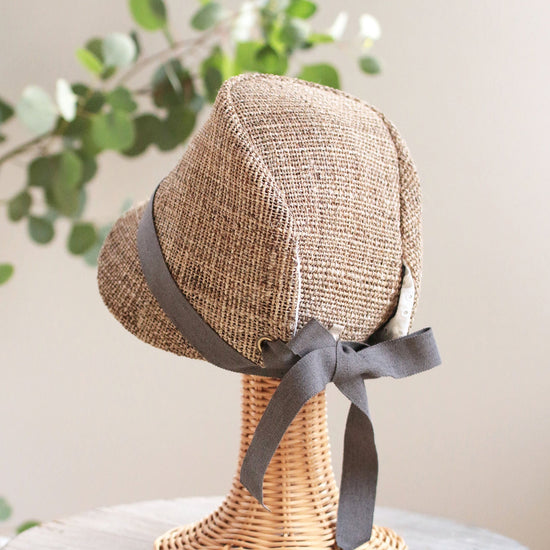 Straw hat with decorative ribbon